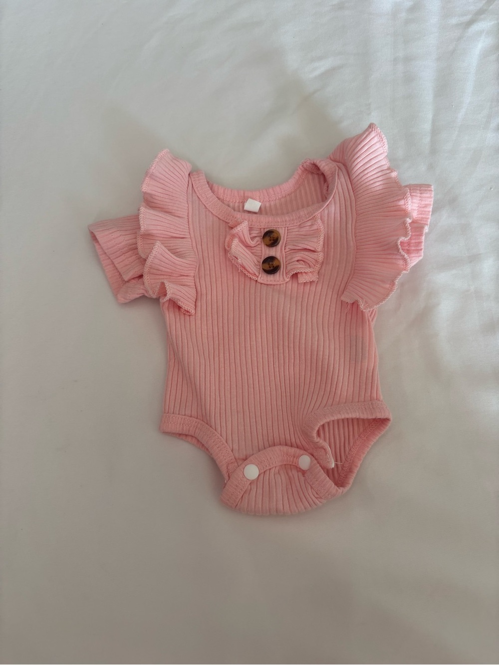 Soft Pink Ribbed Ruffle Baby Bodysuit with Button Detail